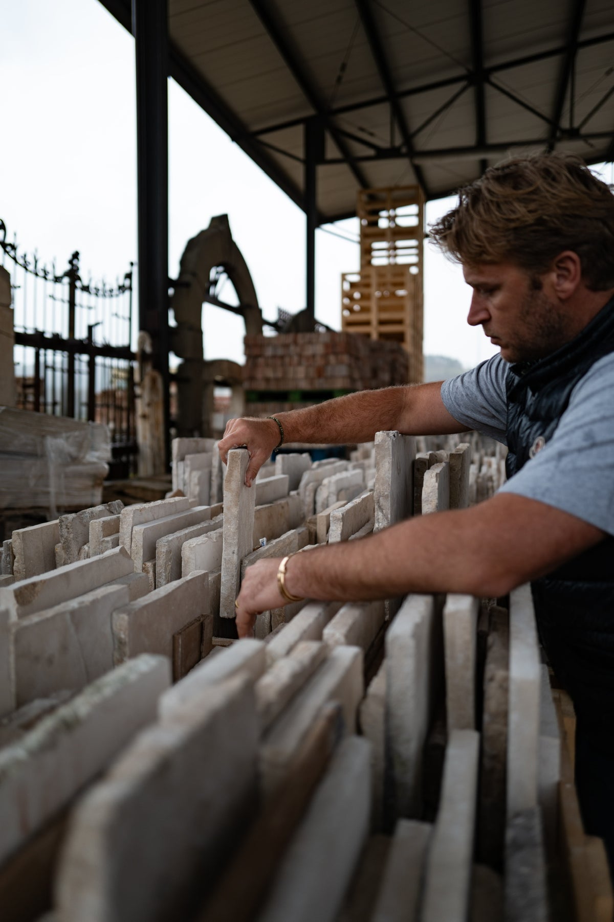 Selecting reclaimed limestone slabs at the yard in Europe