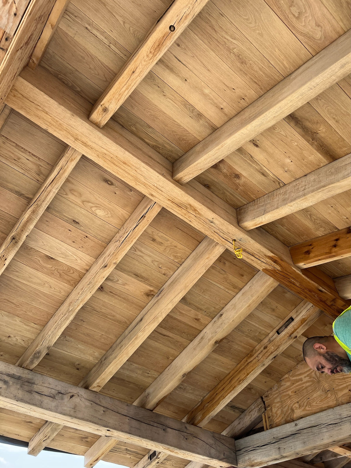 Resawn reclaimed American oak beams showcasing rustic texture and unique grain patterns.