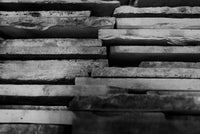 Edges of stacked reclaimed Basilica limestone