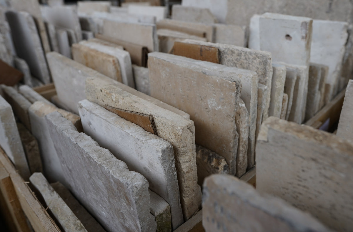 Crates of reclaimed limestone slabs at the source yard