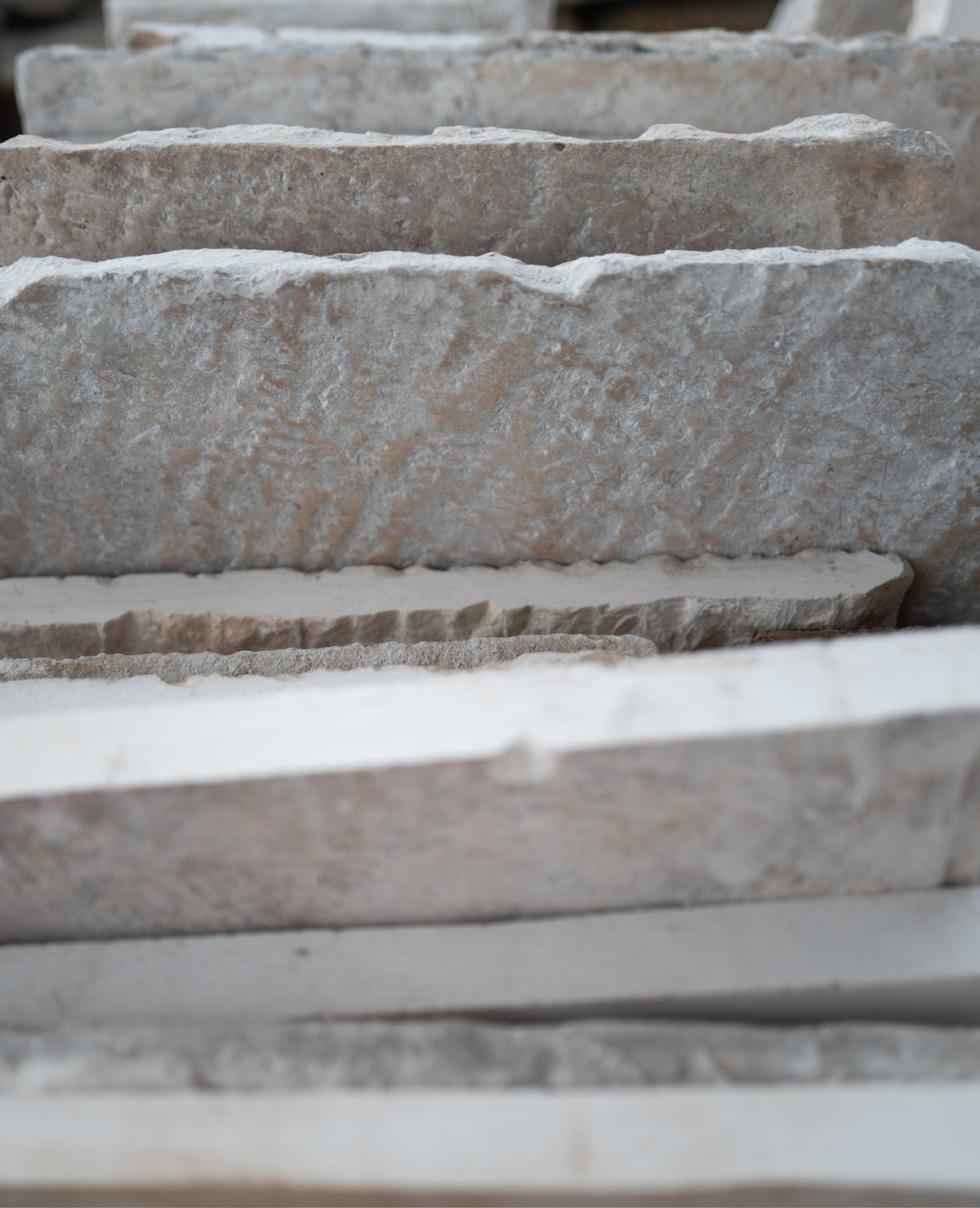 Worn face of a reclaimed limestone slab