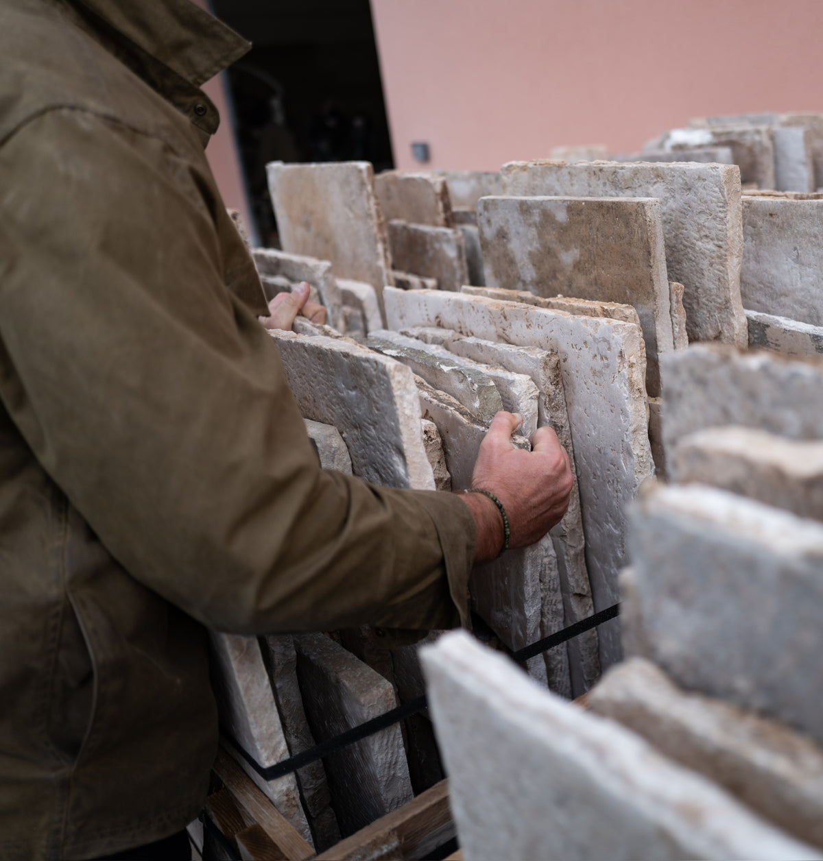 Going through racks of reclaimed limestone slabs
