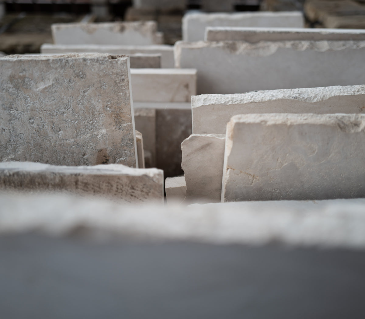 Rows of reclaimed limestone slabs standing on edge