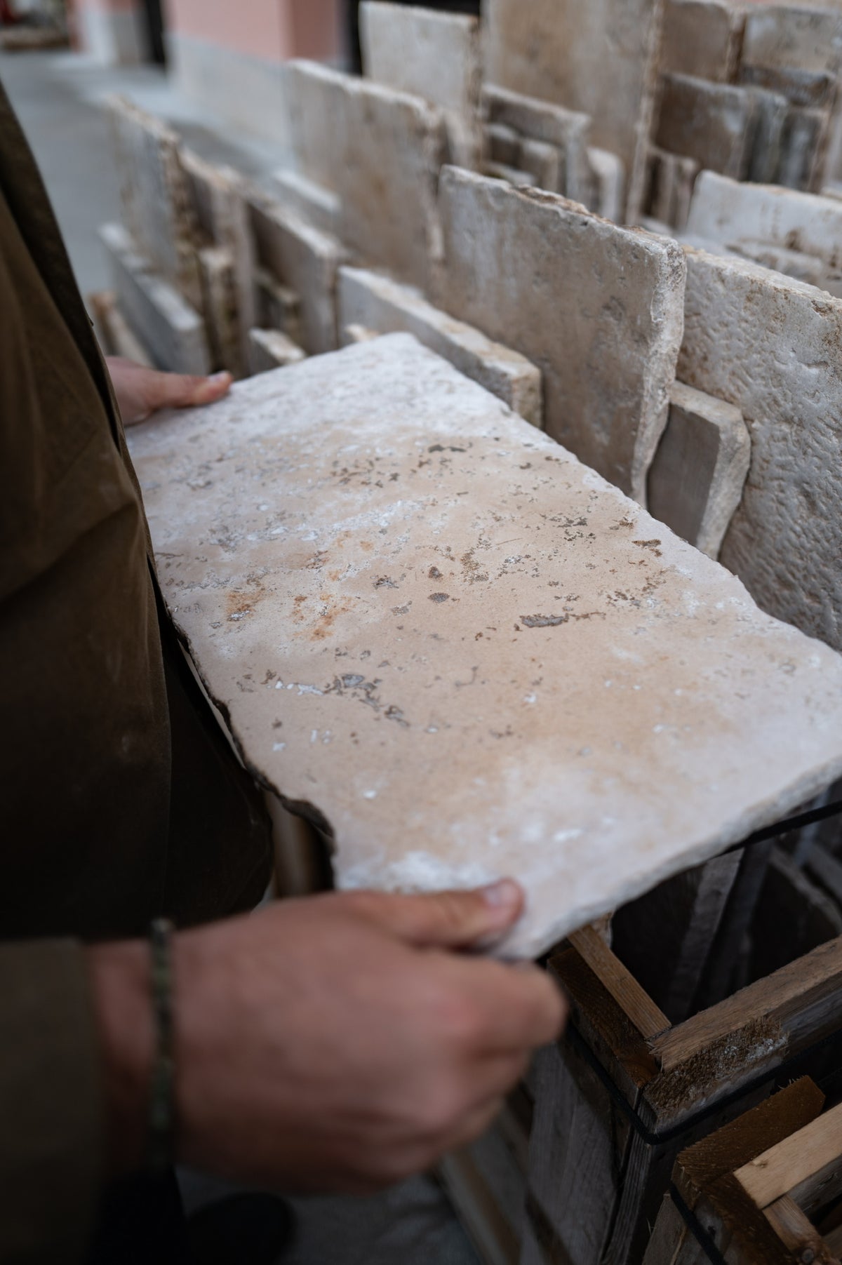 Hand-selecting a reclaimed limestone slab