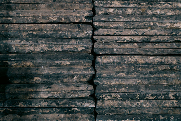 Stacked reclaimed Belgian black church tiles