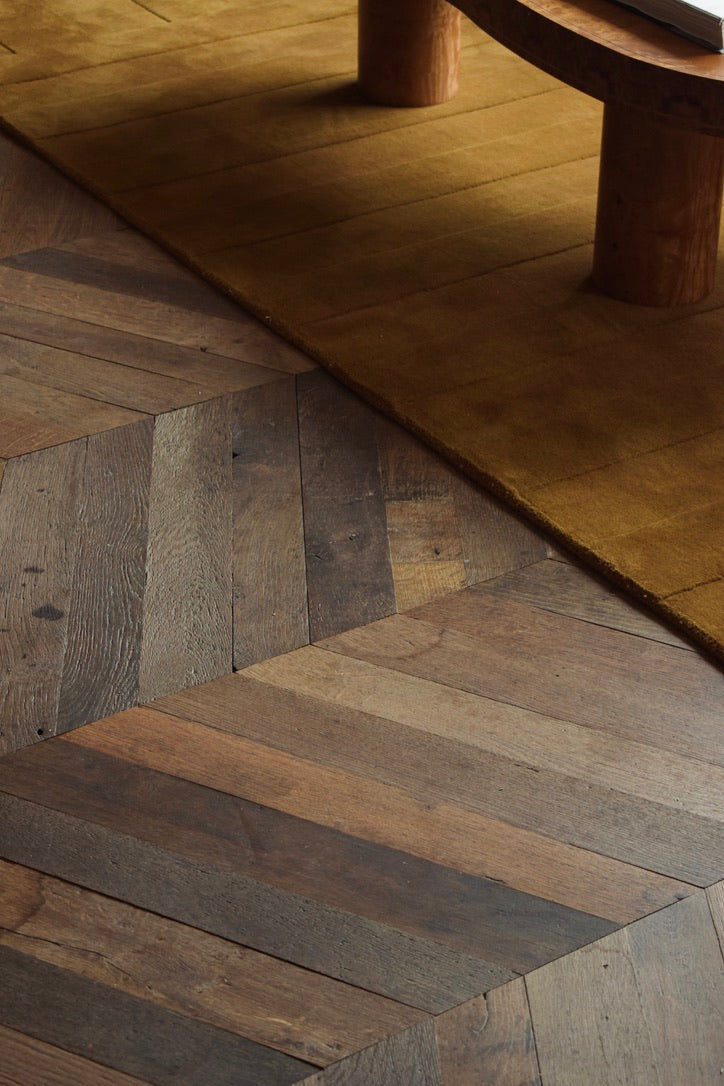 Haussmann chevron oak detail with mustard rug
