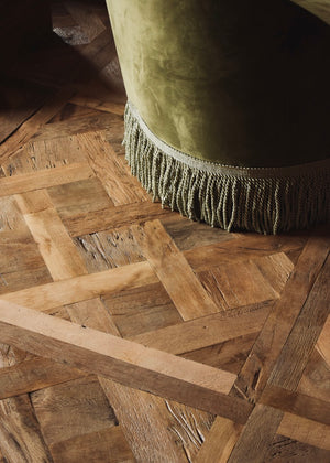 Versailles panel floor detail with fringed chair
