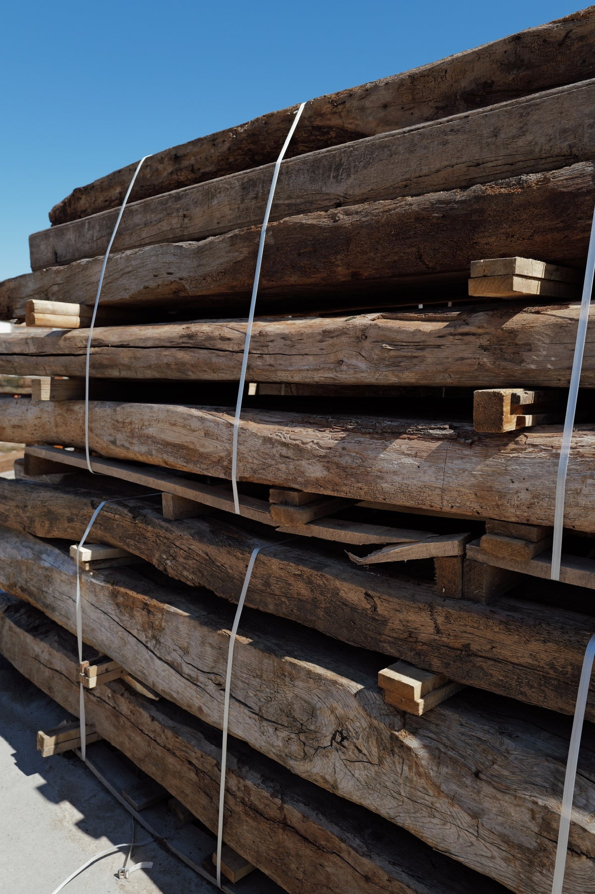 Strapped bundle of hand-hewn reclaimed French oak beams