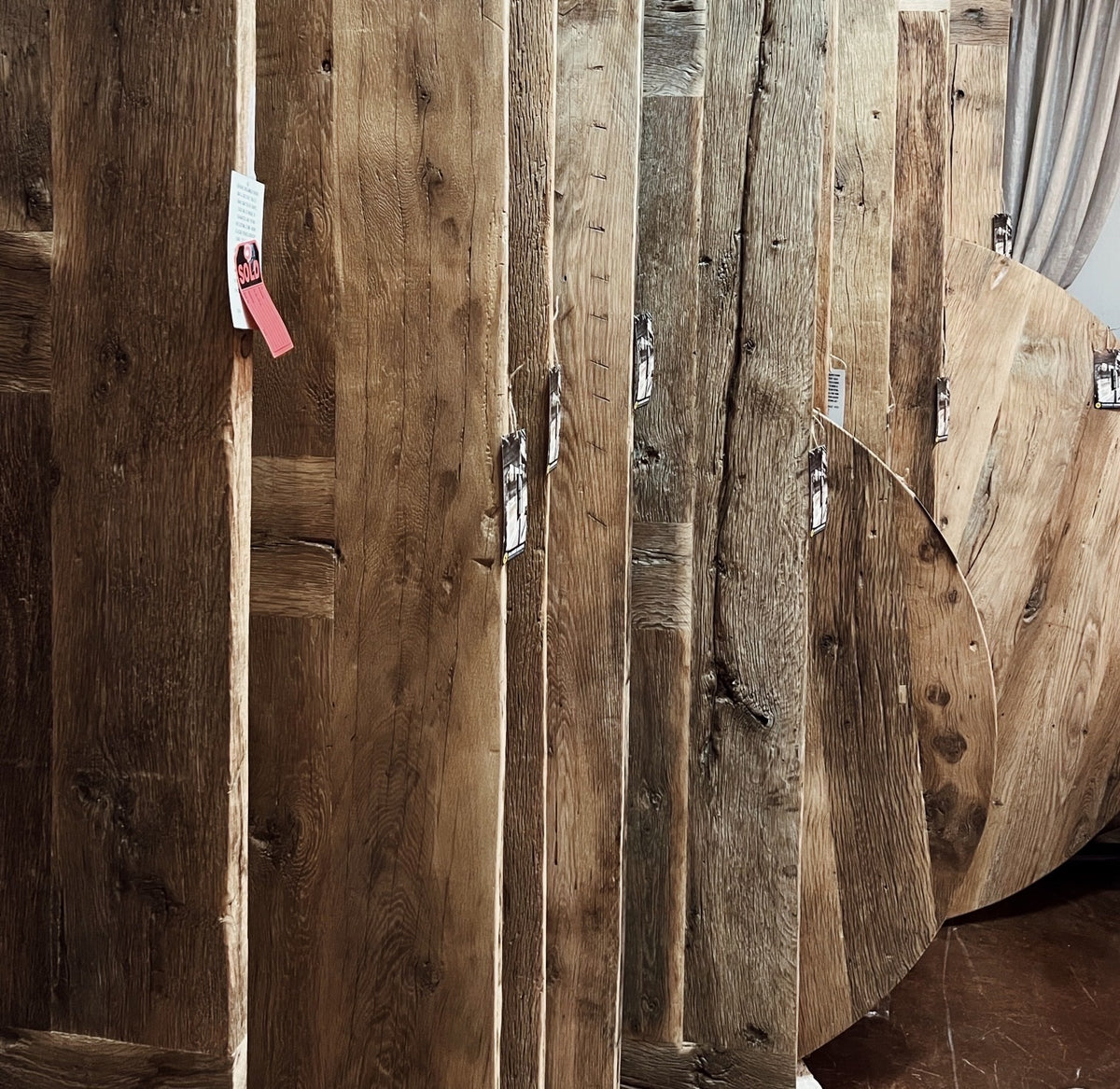 Reclaimed French oak table tops, round and rectangular, in the Los Angeles showroom