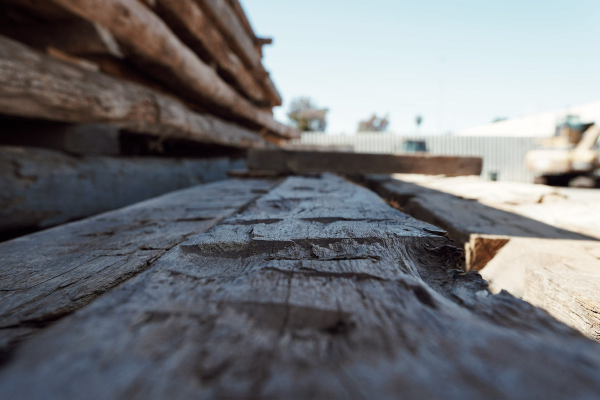 Close-up of hand hewn axe marks on a reclaimed oak beam