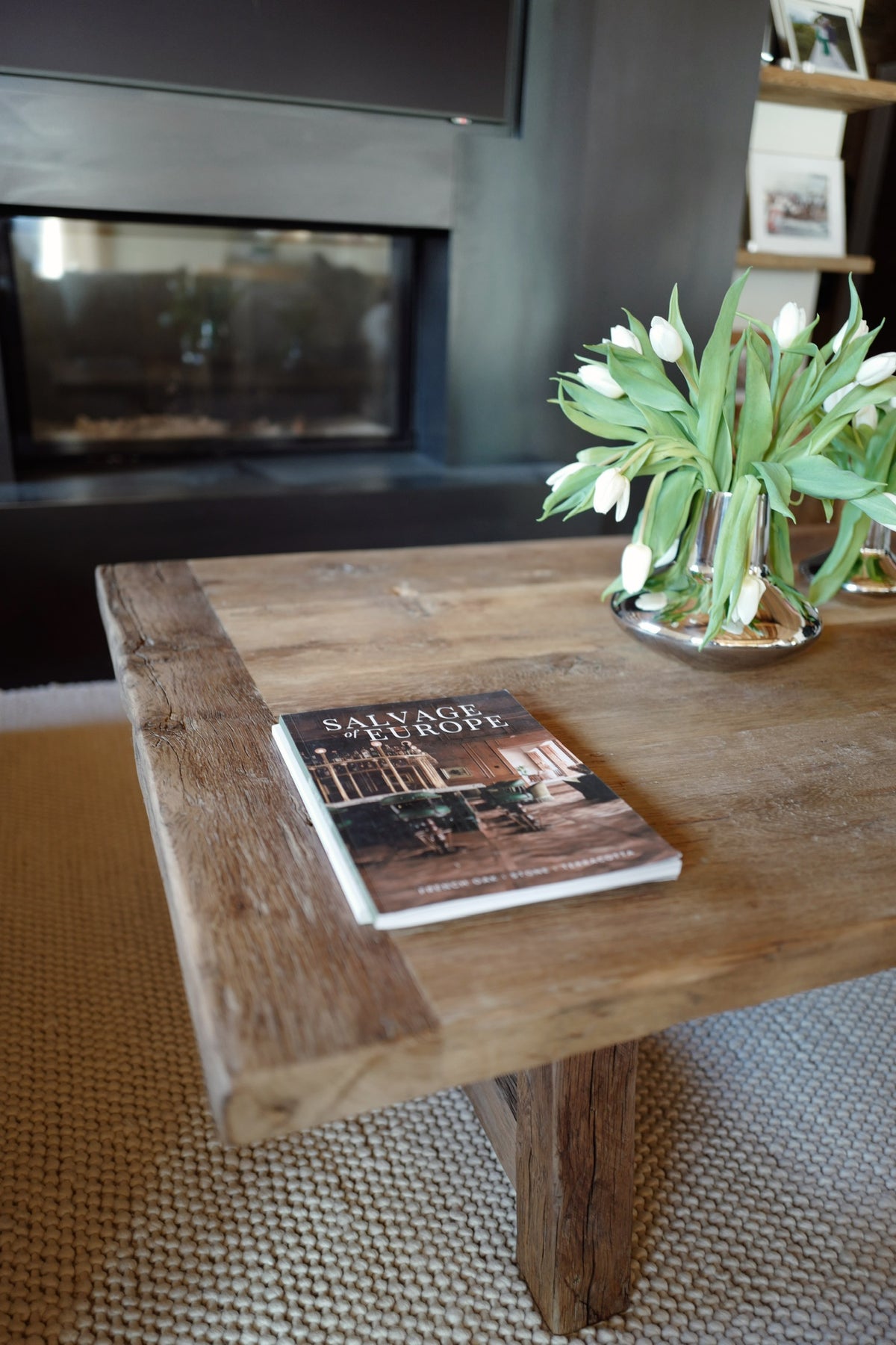 Corner of a reclaimed French oak coffee table with breadboard end