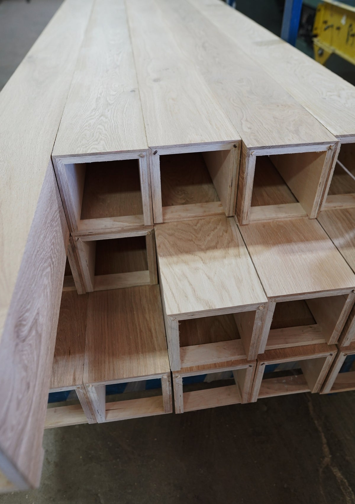 Stacked old growth French oak box beams showing mitered corners