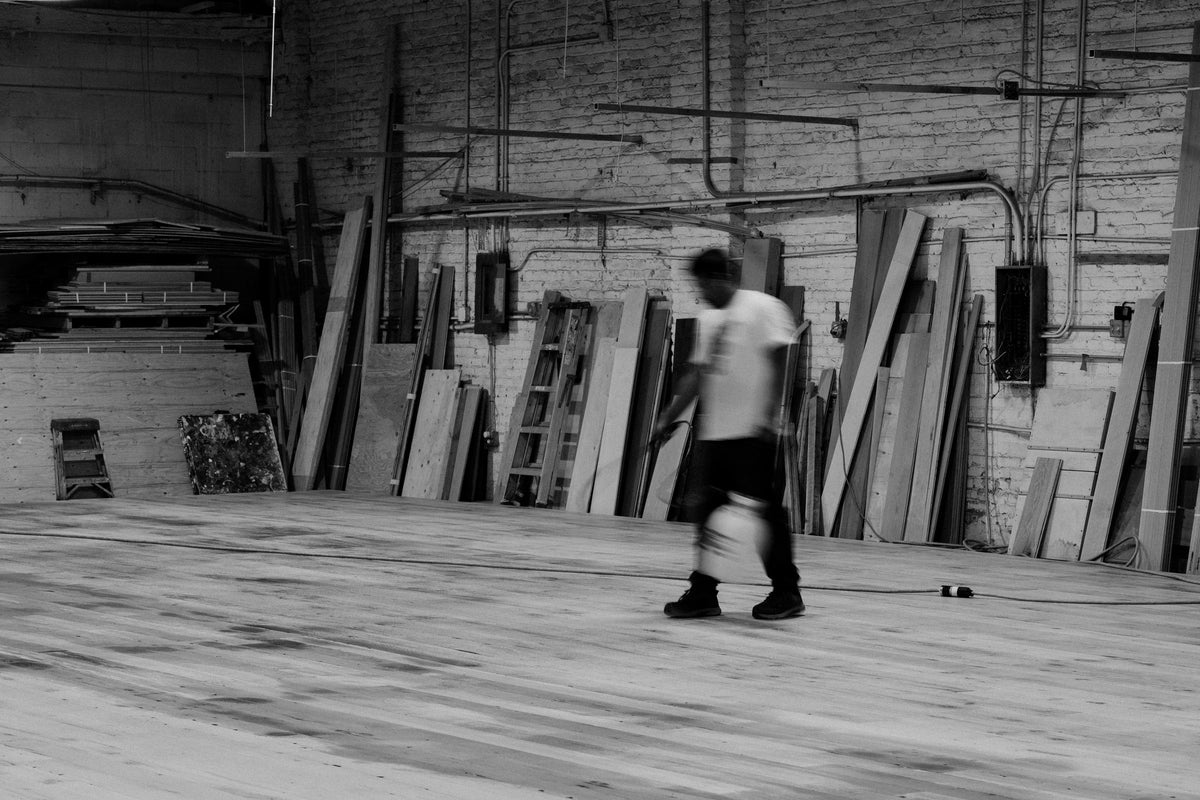 Reclaimed French oak floor laid out across the Salvage Europe workshop floor