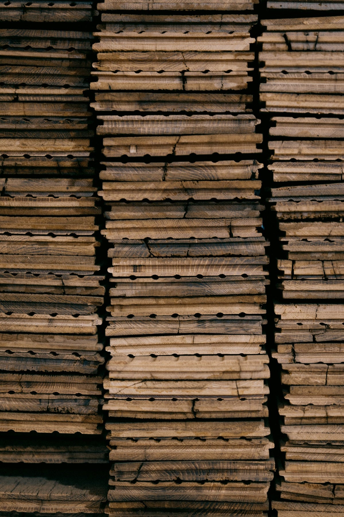 Stacks of reclaimed French oak boards sorted for selection