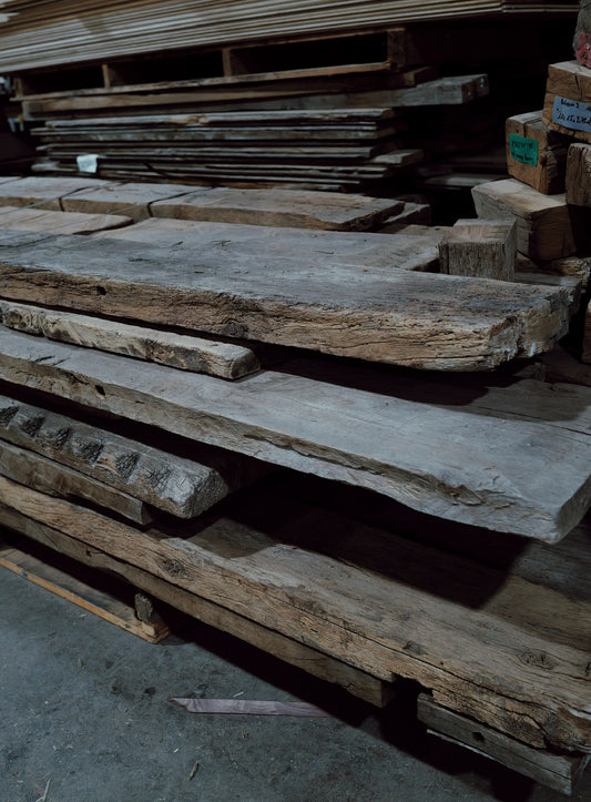 Stack of reclaimed French oak planks and slabs
