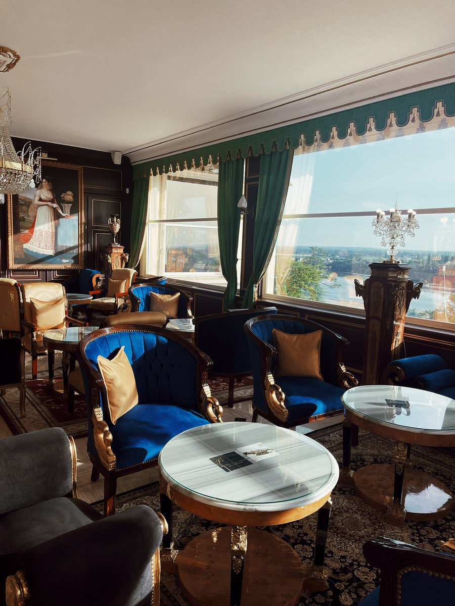 Grand villa salon with antique furniture and river views