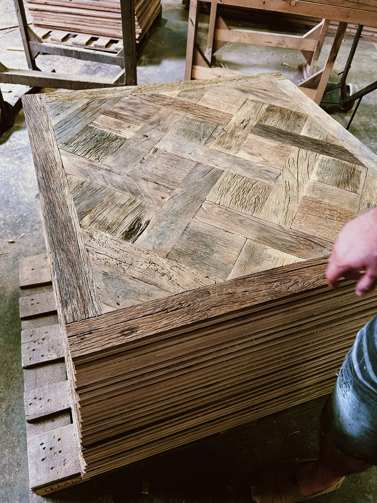 Stack of reclaimed French oak Versailles panels, original face